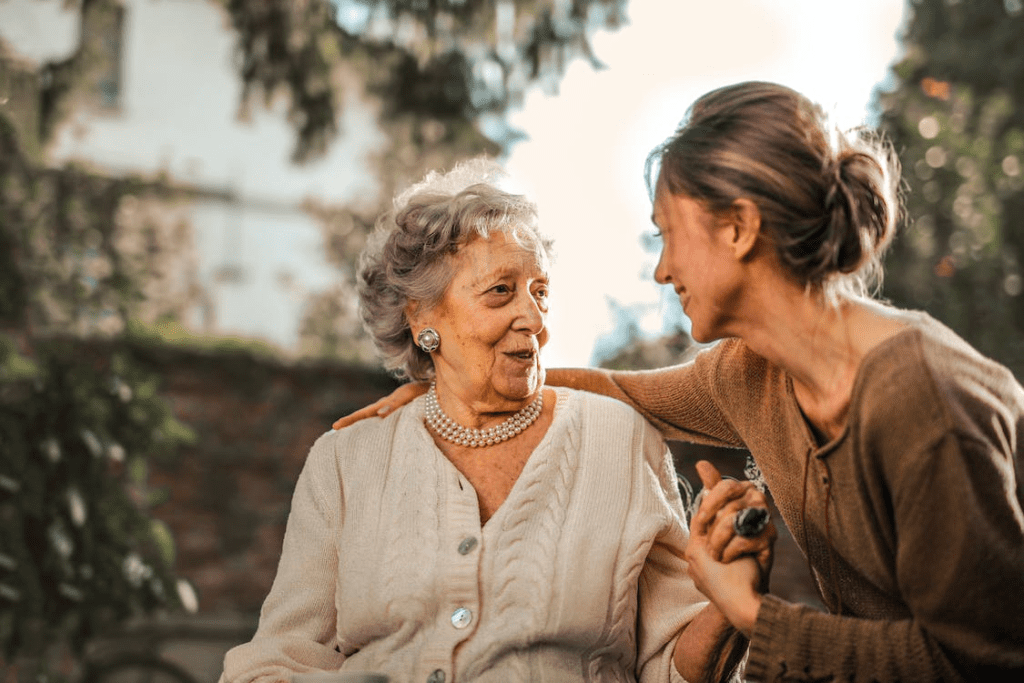 an older woman with a caregiver.