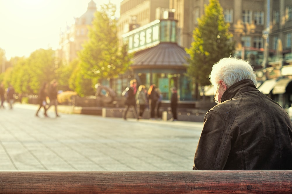 a man sitting outdoors. 