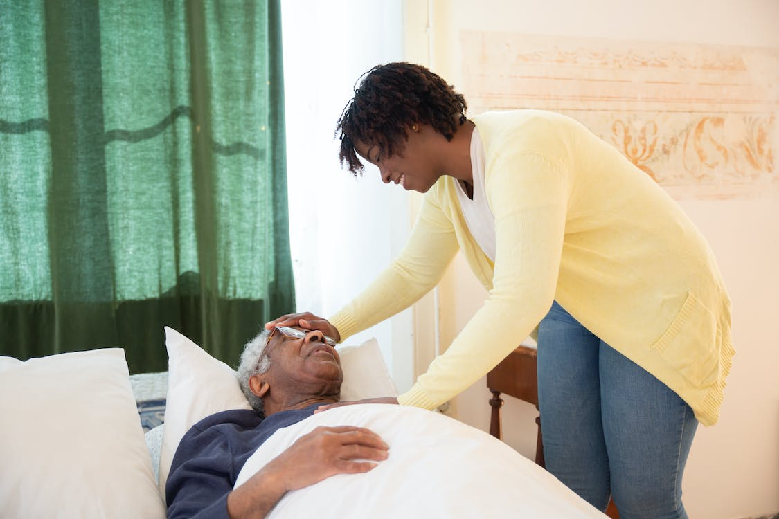 a caregiver sharing stroke recovery strategies with their patient.