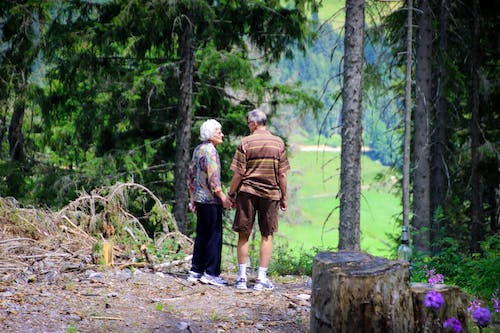  an elderly couple hiking together
