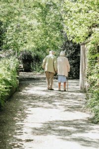 an elderly couple on a walk.