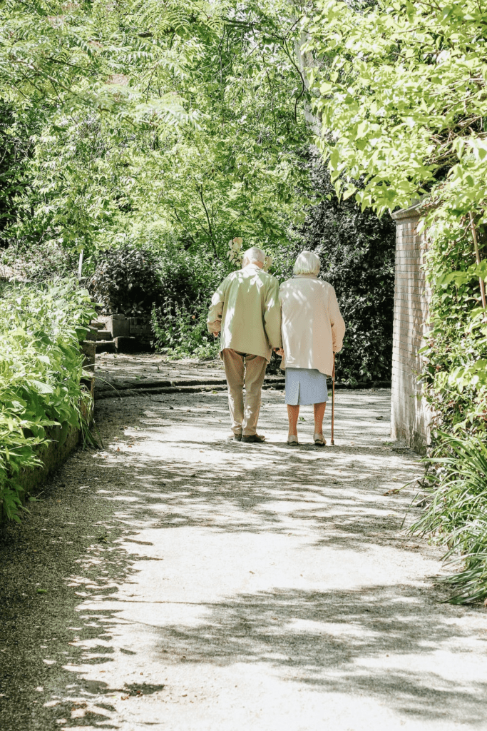 an elderly couple on a walk.