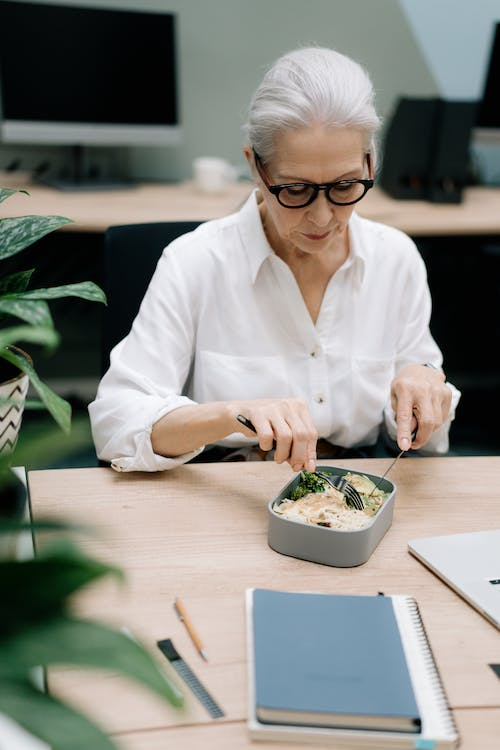  a woman eating her lunch