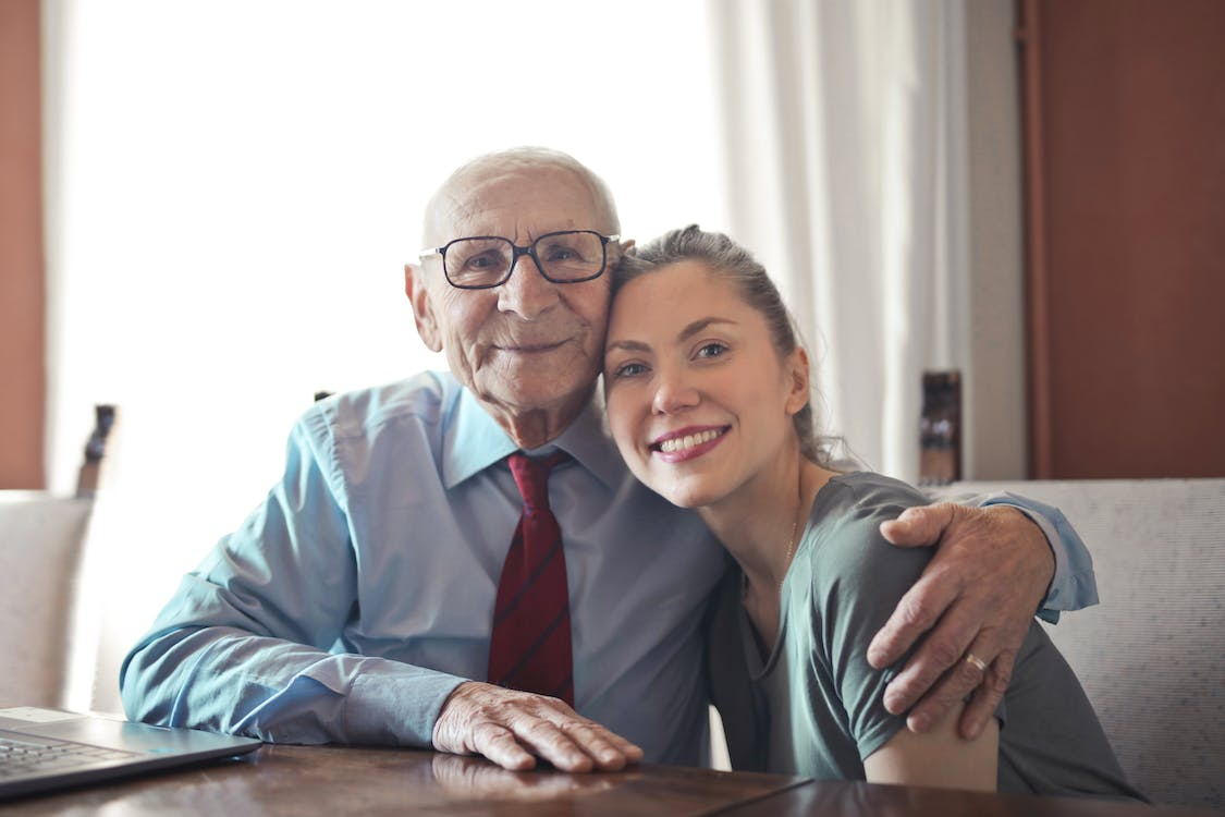 an older man with a caregiver