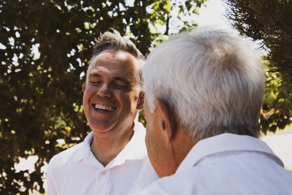 two men having a conversation. 