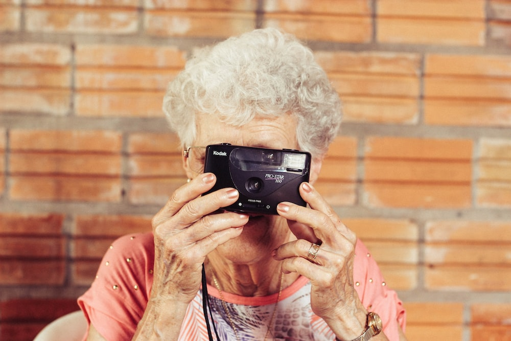 a woman holding a camera. 